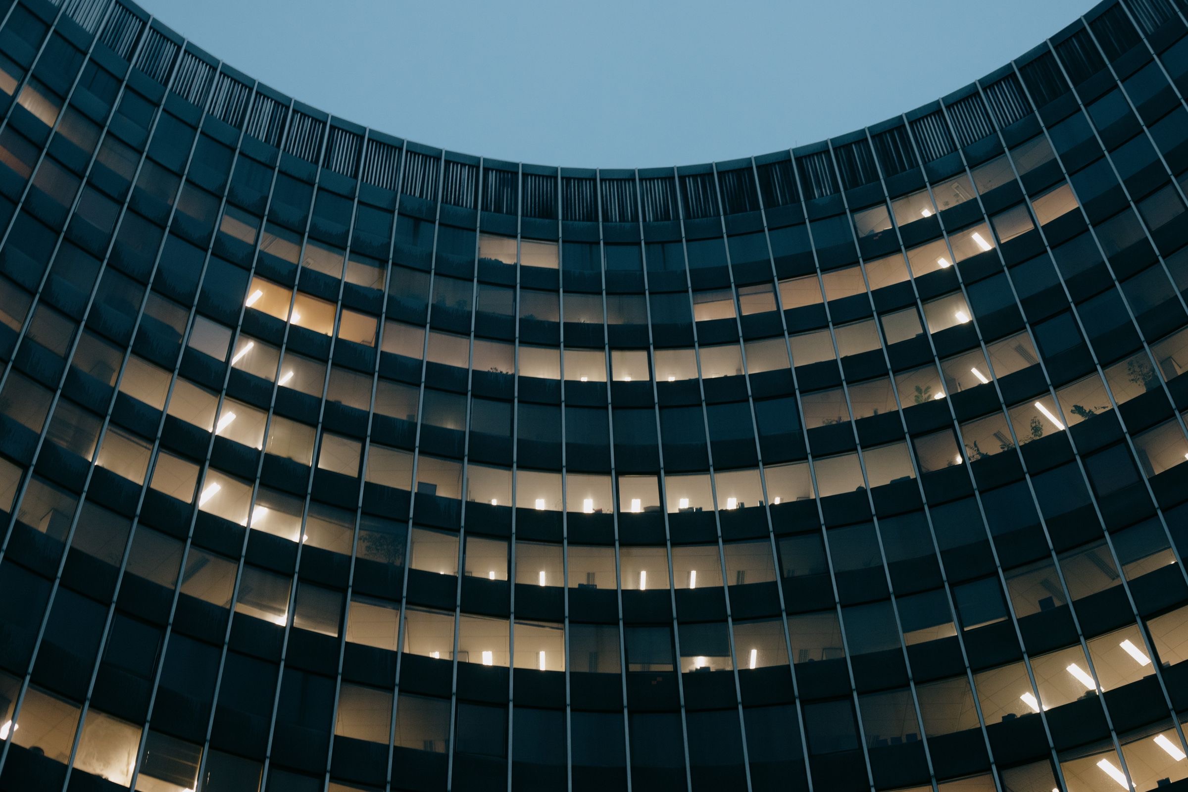 A boardroom table by a window overlooking a Brussels street